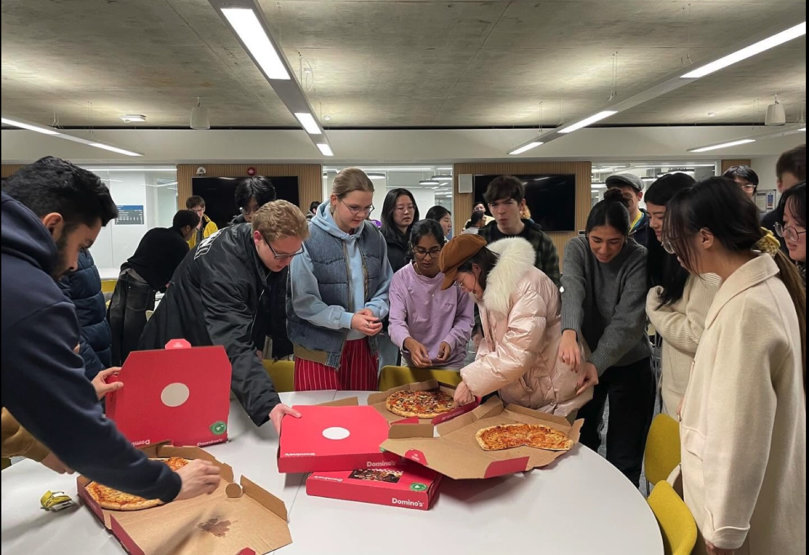 Members grabbing pizza